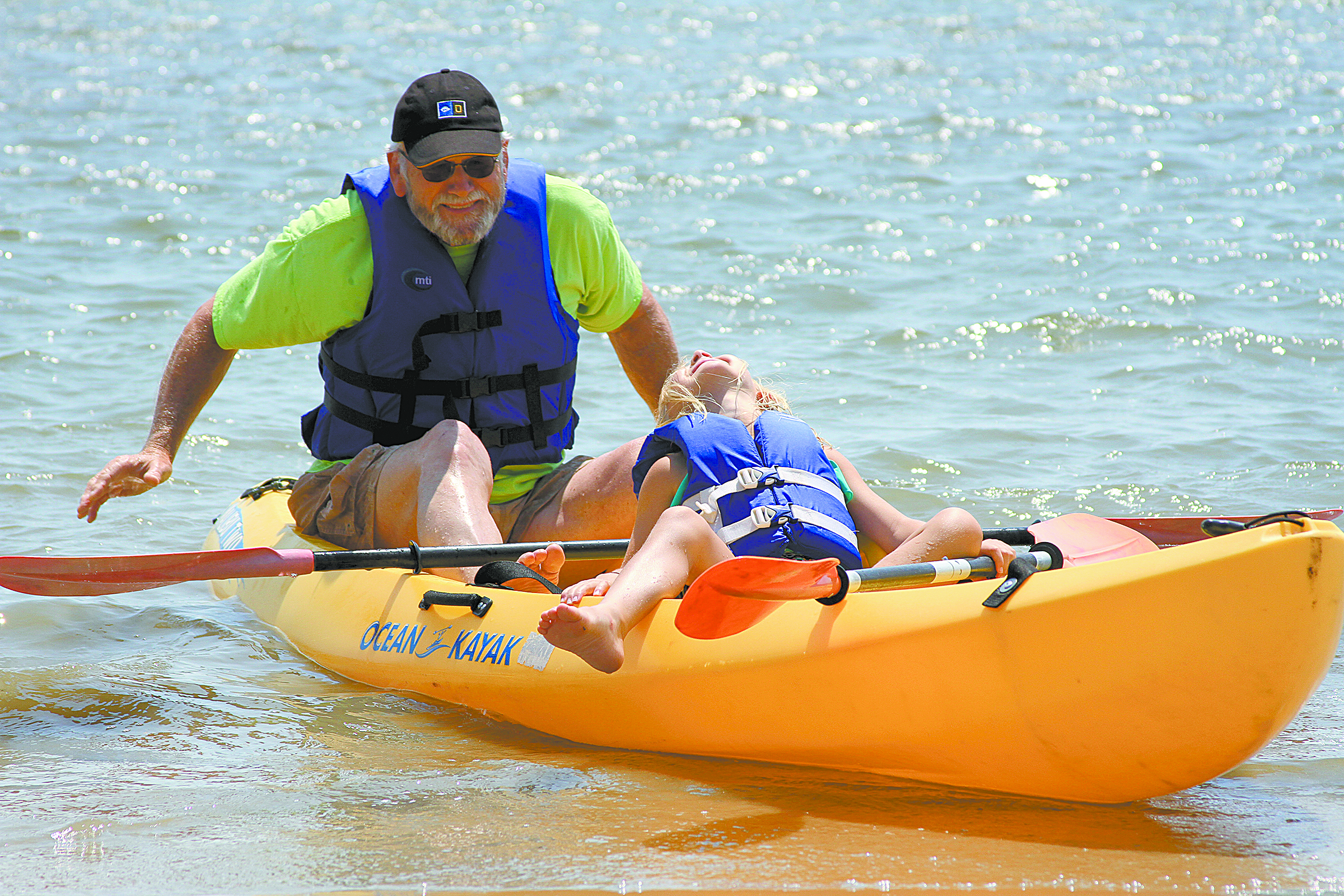 Grandfather enjoys time in canoe with granddaughter