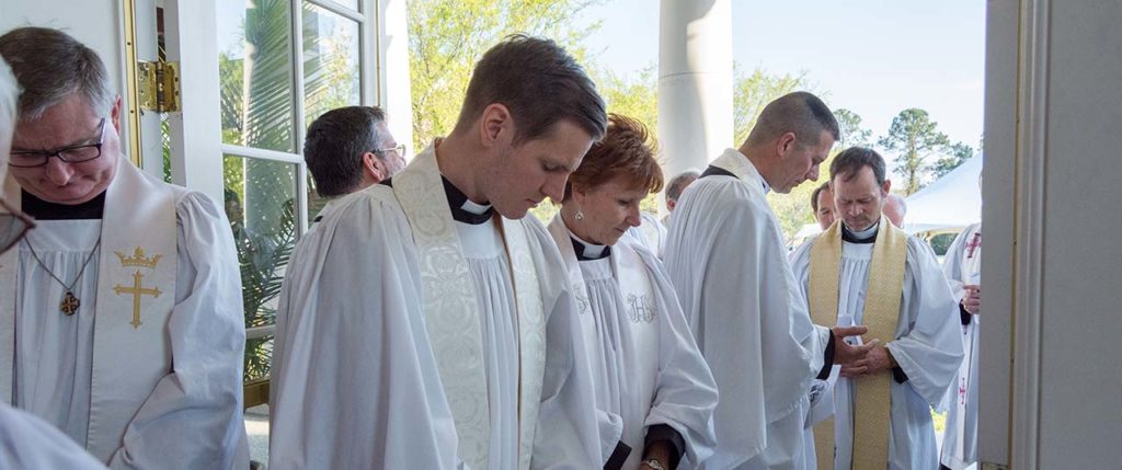 Clergy Pray prior to convention