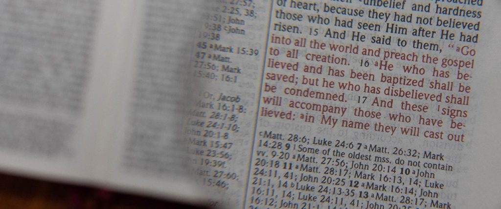 Bible and Magnifying Glass
