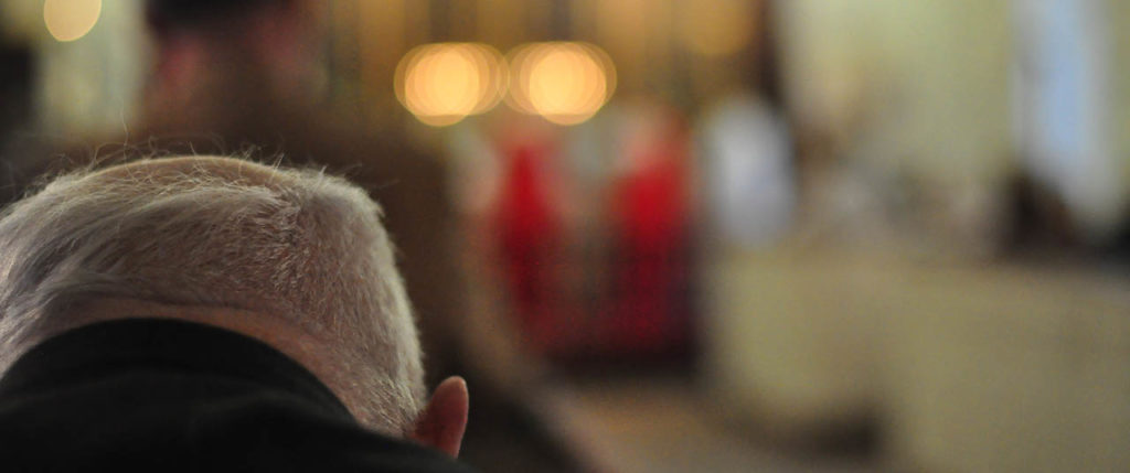 Man in prayer at service