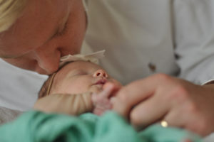 Father kisses baby jlh