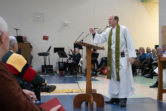 The Rev. Ted Duvall preaching at Christ Church Anglican in Jennie Moore Elementary