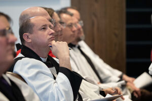 Hamilton Smith and other clergy listening to sermon.